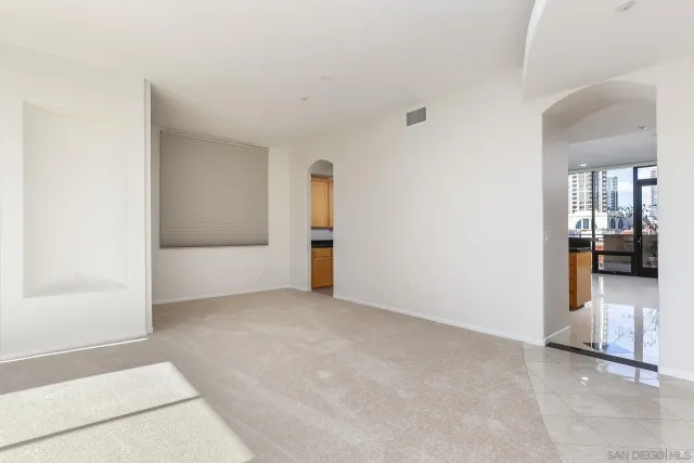 a kitchen with stainless steel appliances granite countertop a sink counter space cabinets and a large window