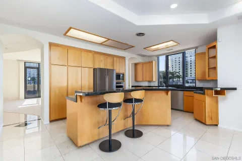 a kitchen that has a sink and cabinets