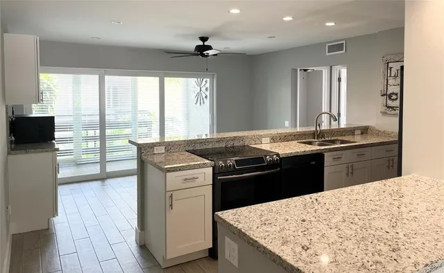 a kitchen with a stove and a sink