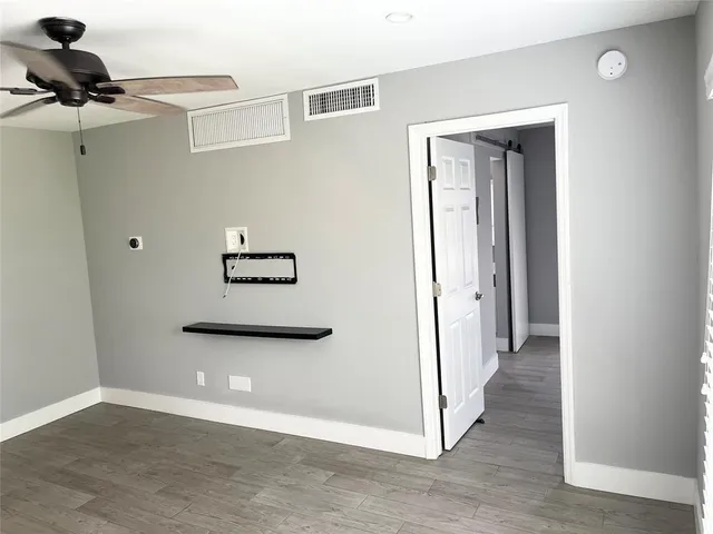 a view of a livingroom with a hallway