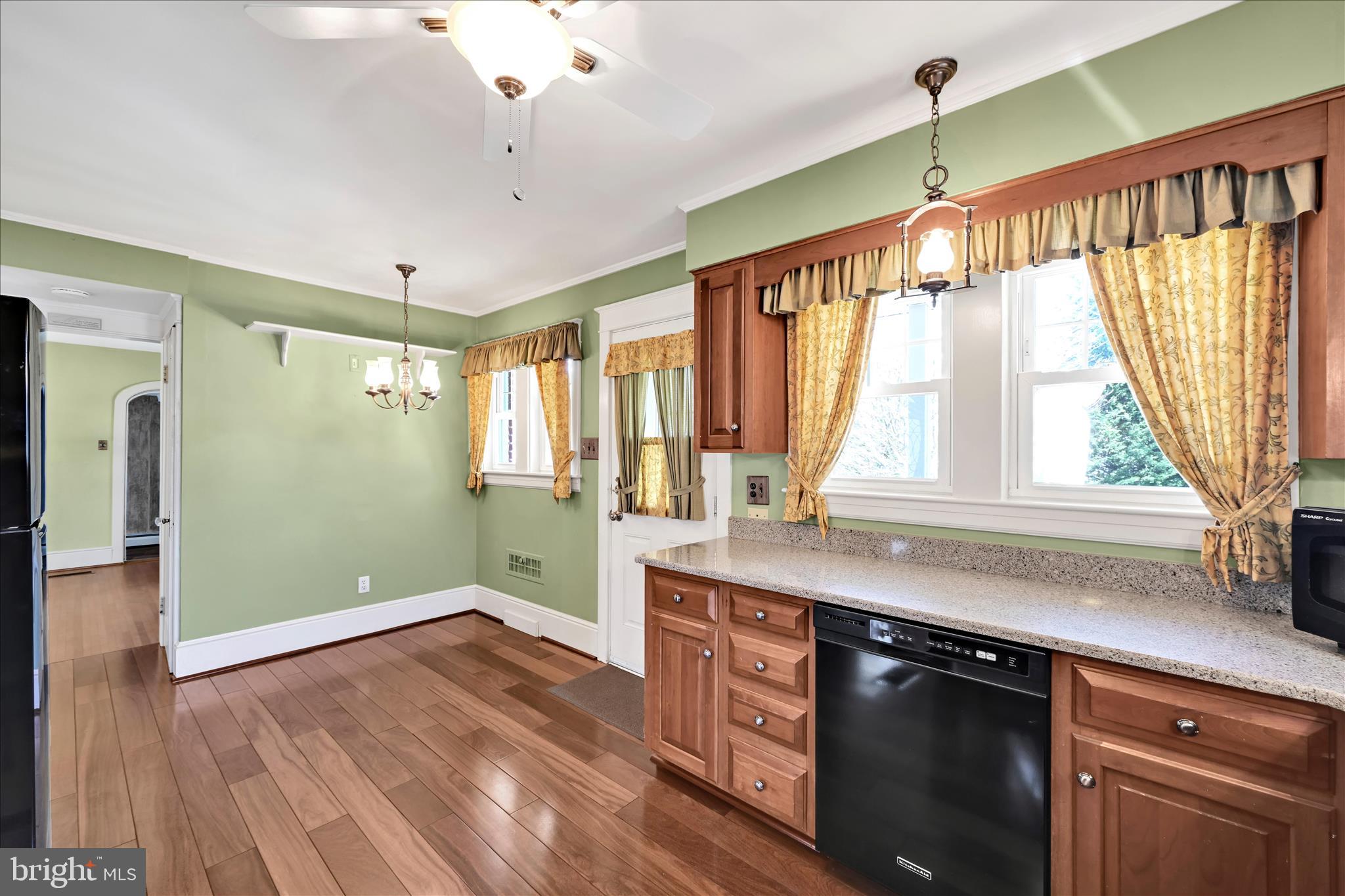 715 South Main Street Red Lion, PA 17356 - Photo 16 of 44 a kitchen with a wooden floor and a window