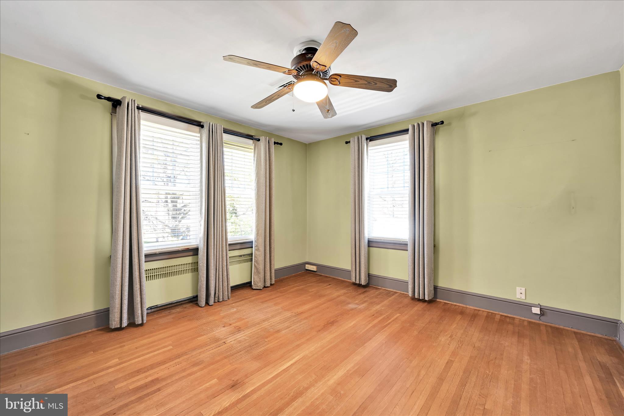715 South Main Street Red Lion, PA 17356 - Photo 20 of 44 an empty room with wooden floor and windows