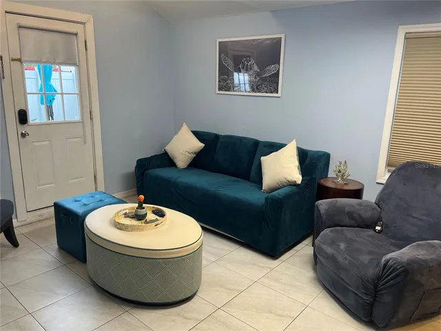 a living room with furniture and a window