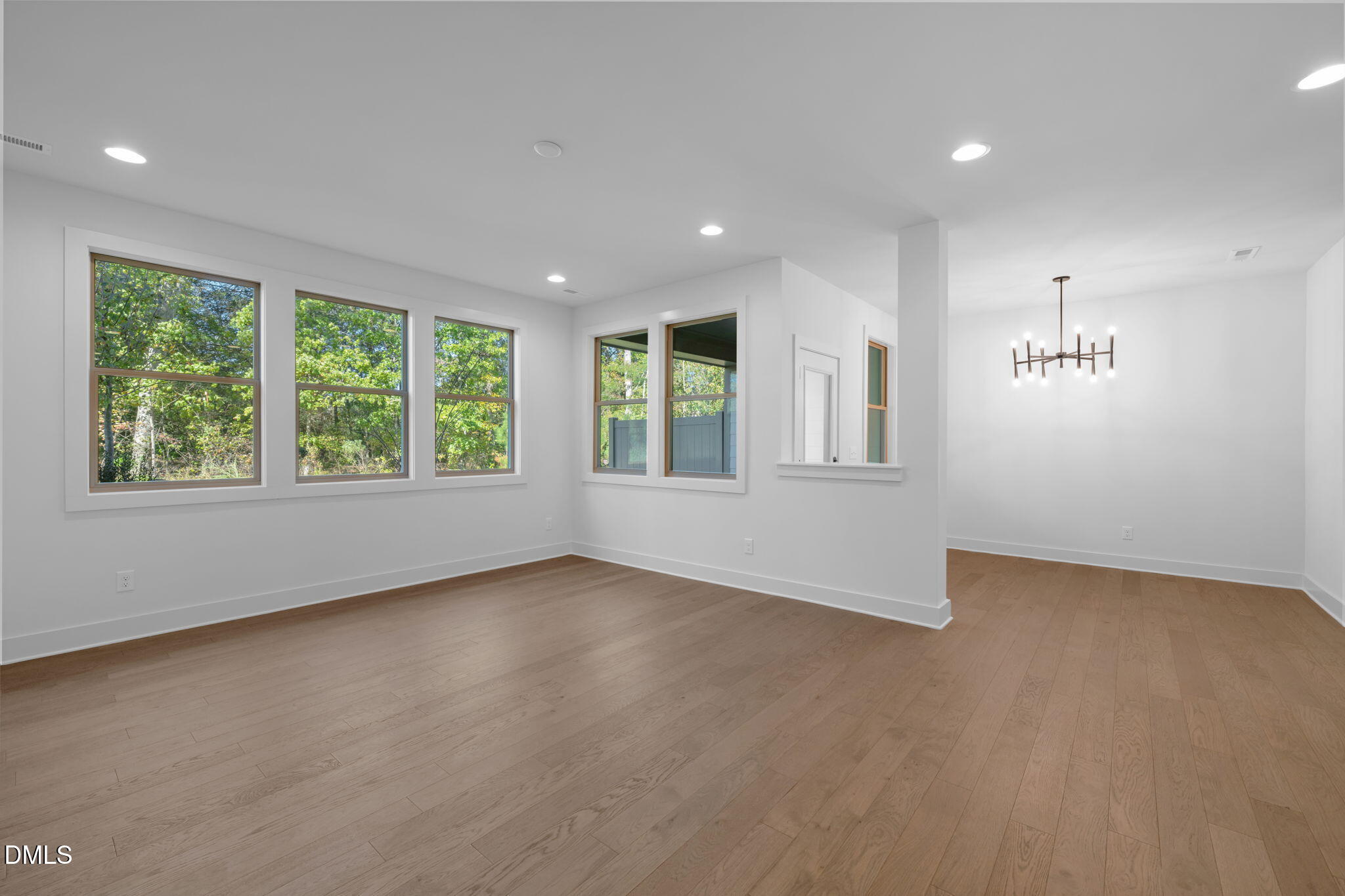 968 Double Helix Road Apex, NC 27523 - Photo 3 of 44 an empty room with windows