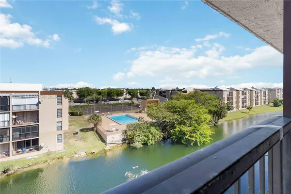 a view of swimming pool from a balcony
