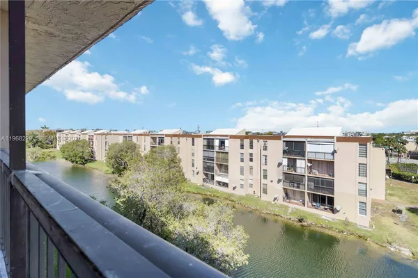 a view of a large building with a lake view