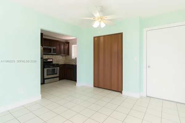 a view of kitchen with cabinets