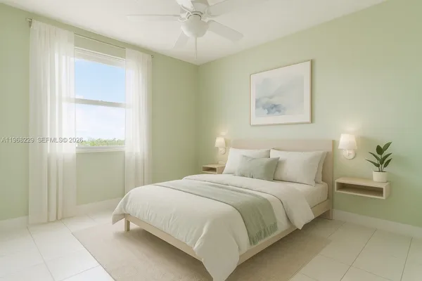 a bedroom with a bed and a painting on the wall