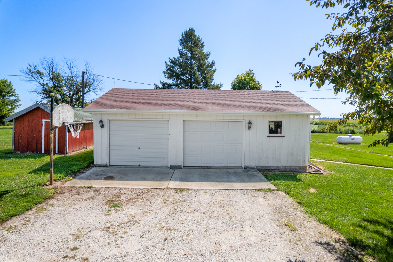 10435 South County Line Road Leland, IL 60531 - Photo 42 of 58 a house with a yard and a large parking space