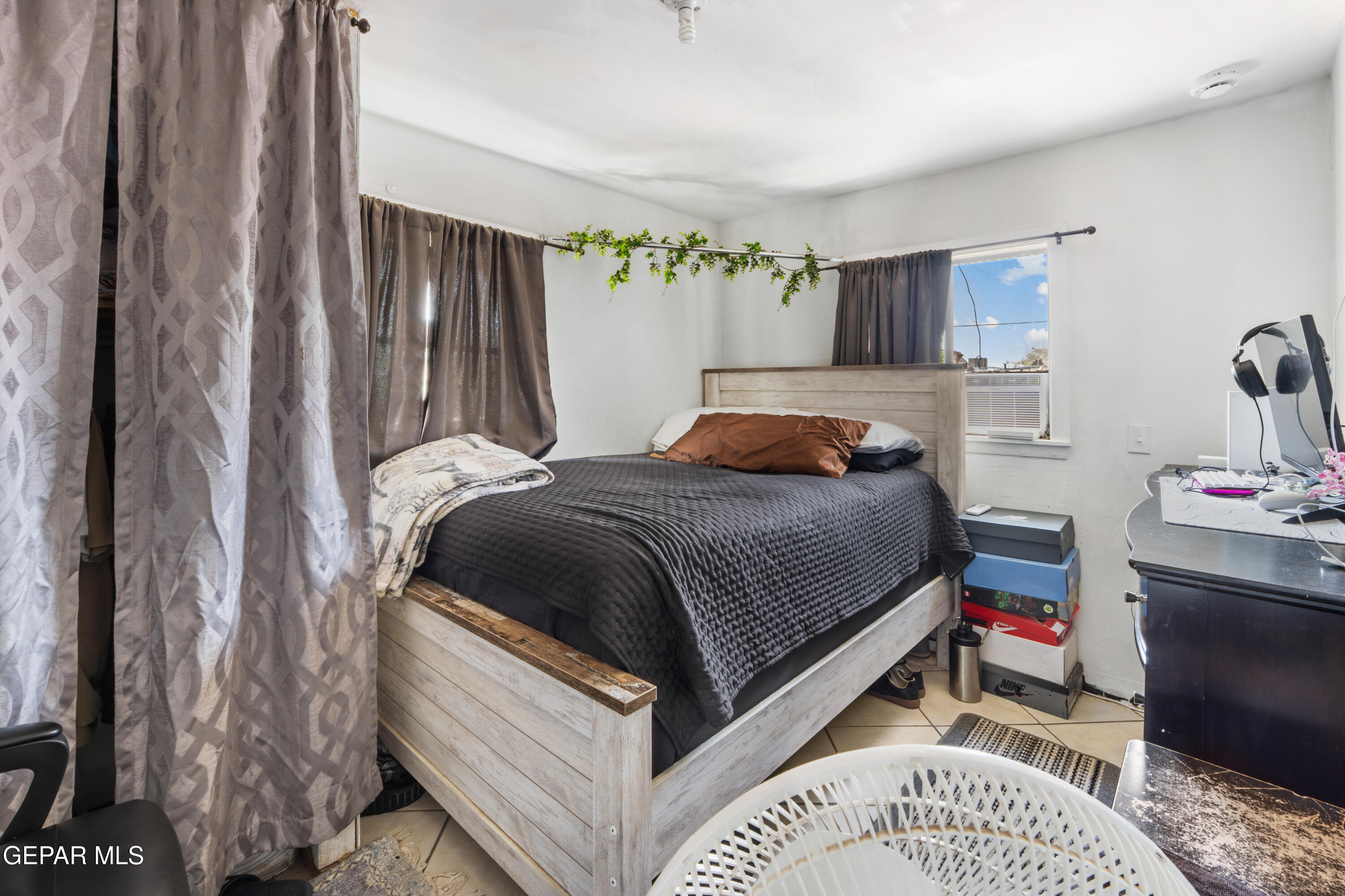 219 Polo Inn Road El Paso, TX 79915 - Photo 12 of 25 a bedroom with a bed and a cabinets
