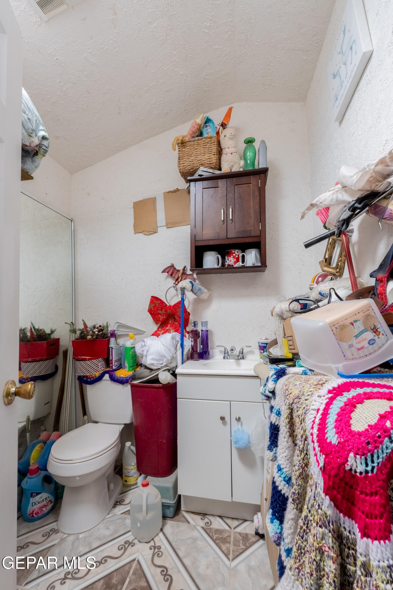 219 Polo Inn Road El Paso, TX 79915 - Photo 17 of 25 a bedroom with a bed and a couch