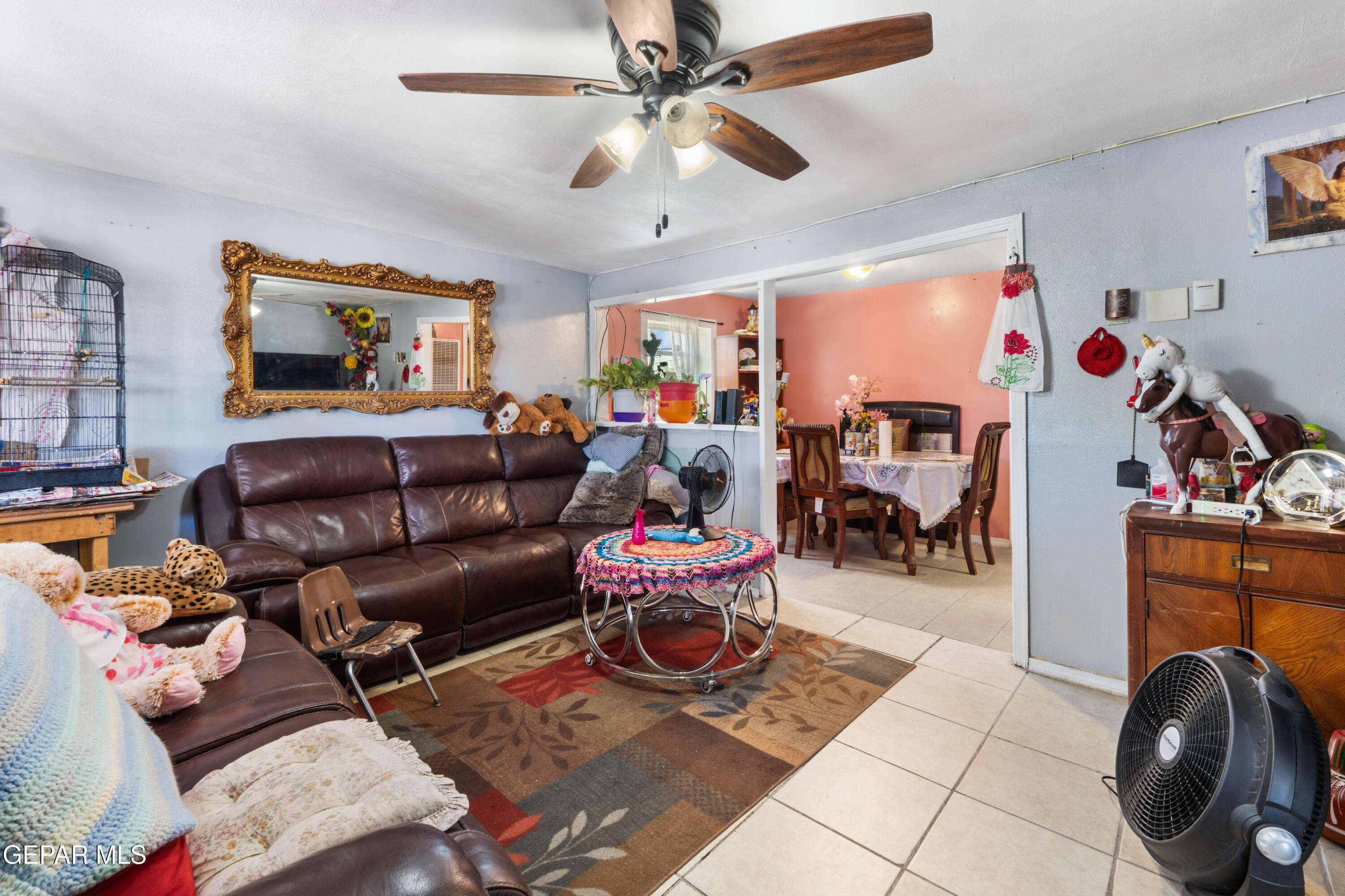 219 Polo Inn Road El Paso, TX 79915 - Photo 5 of 25 a living room with furniture and a flat screen tv