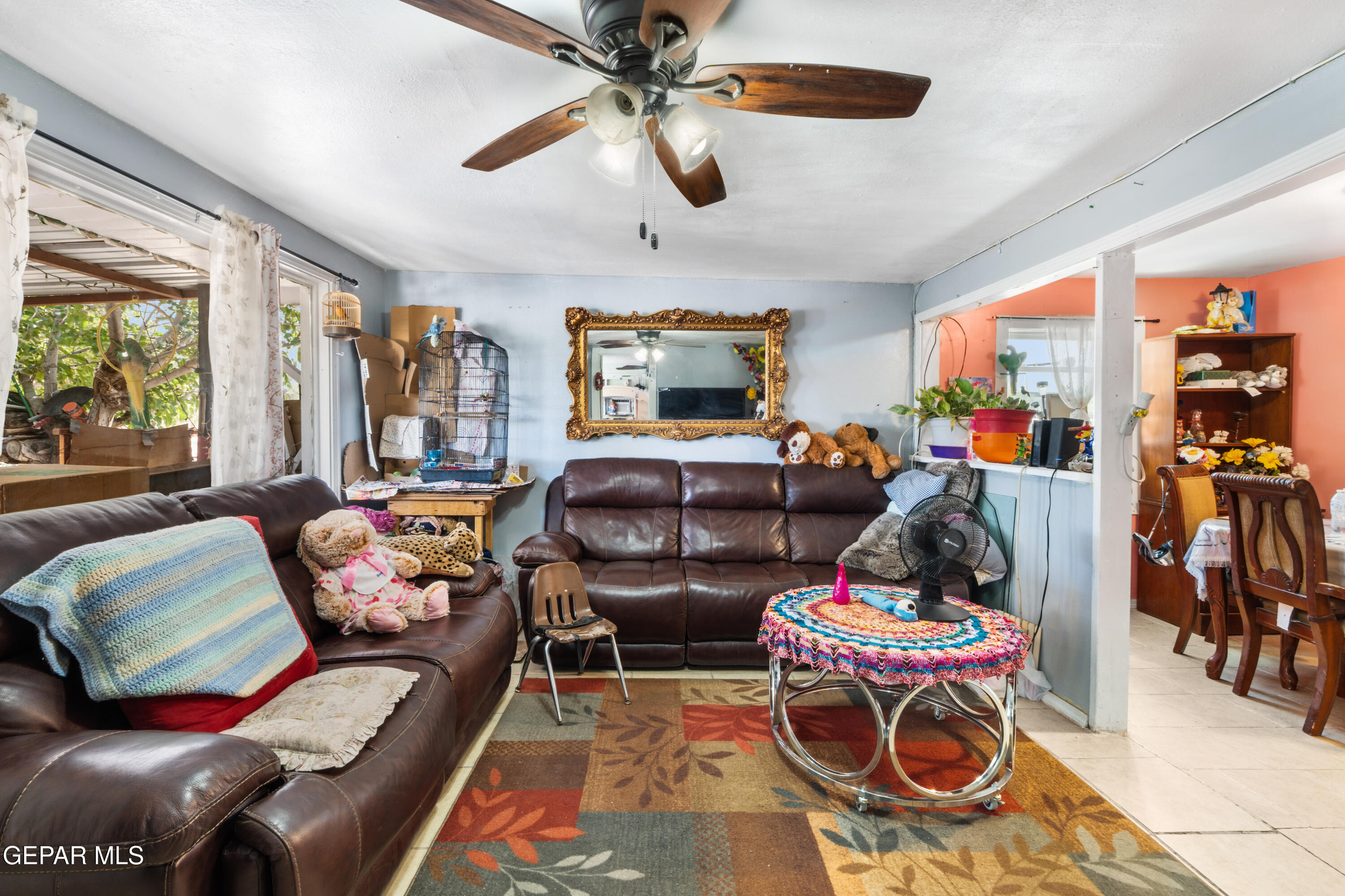 219 Polo Inn Road El Paso, TX 79915 - Photo 6 of 25 a living room filled with furniture and a chandelier