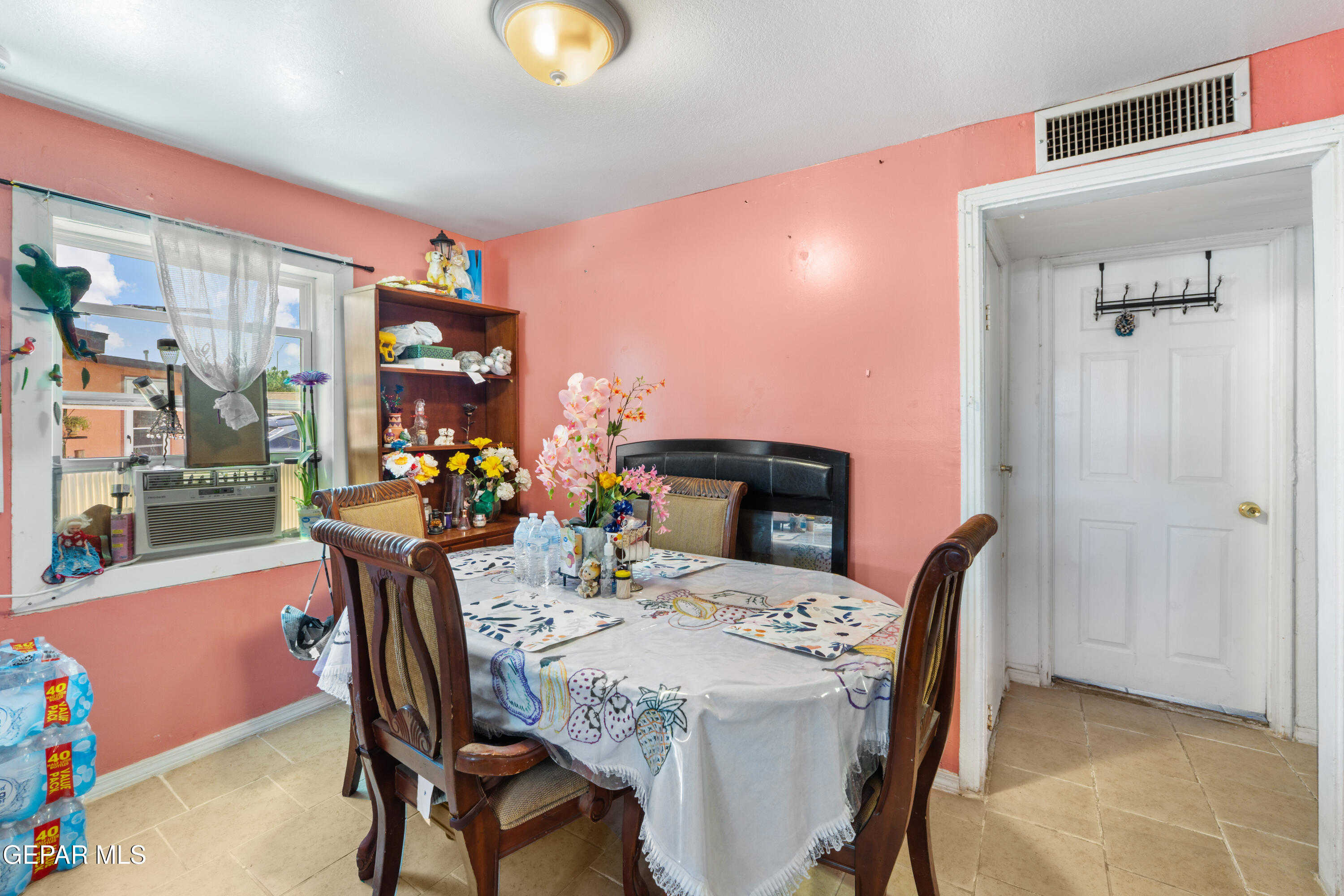 219 Polo Inn Road El Paso, TX 79915 - Photo 8 of 25 a view of a dining room with furniture and a potted plant