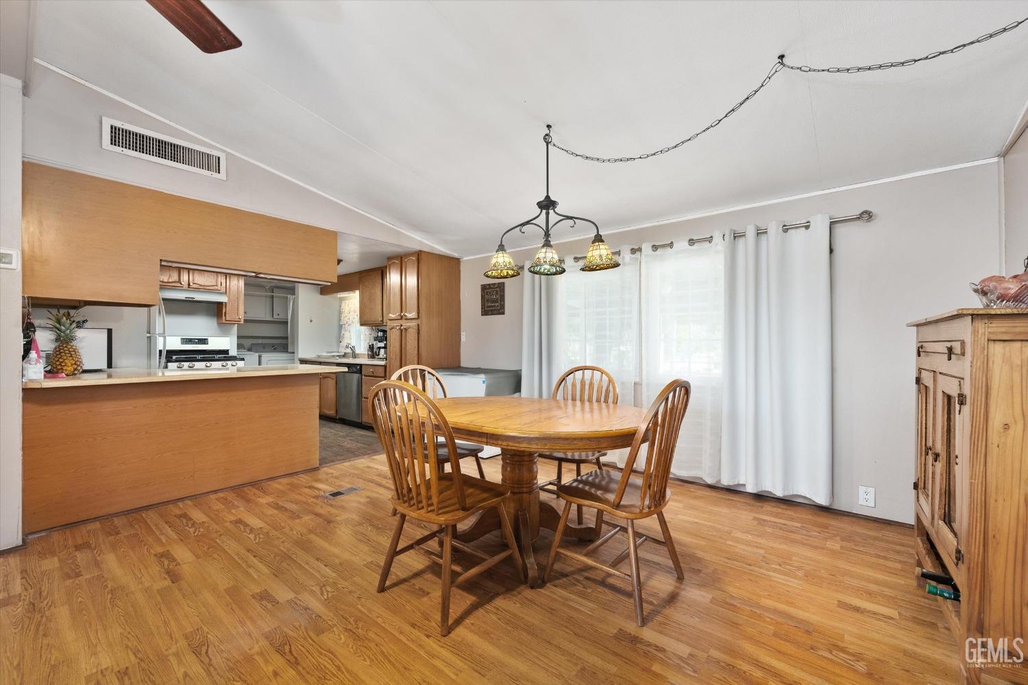 Undisclosed Address Bakersfield, CA 93314 - Photo 11 of 34 a view of a dining room with furniture and window