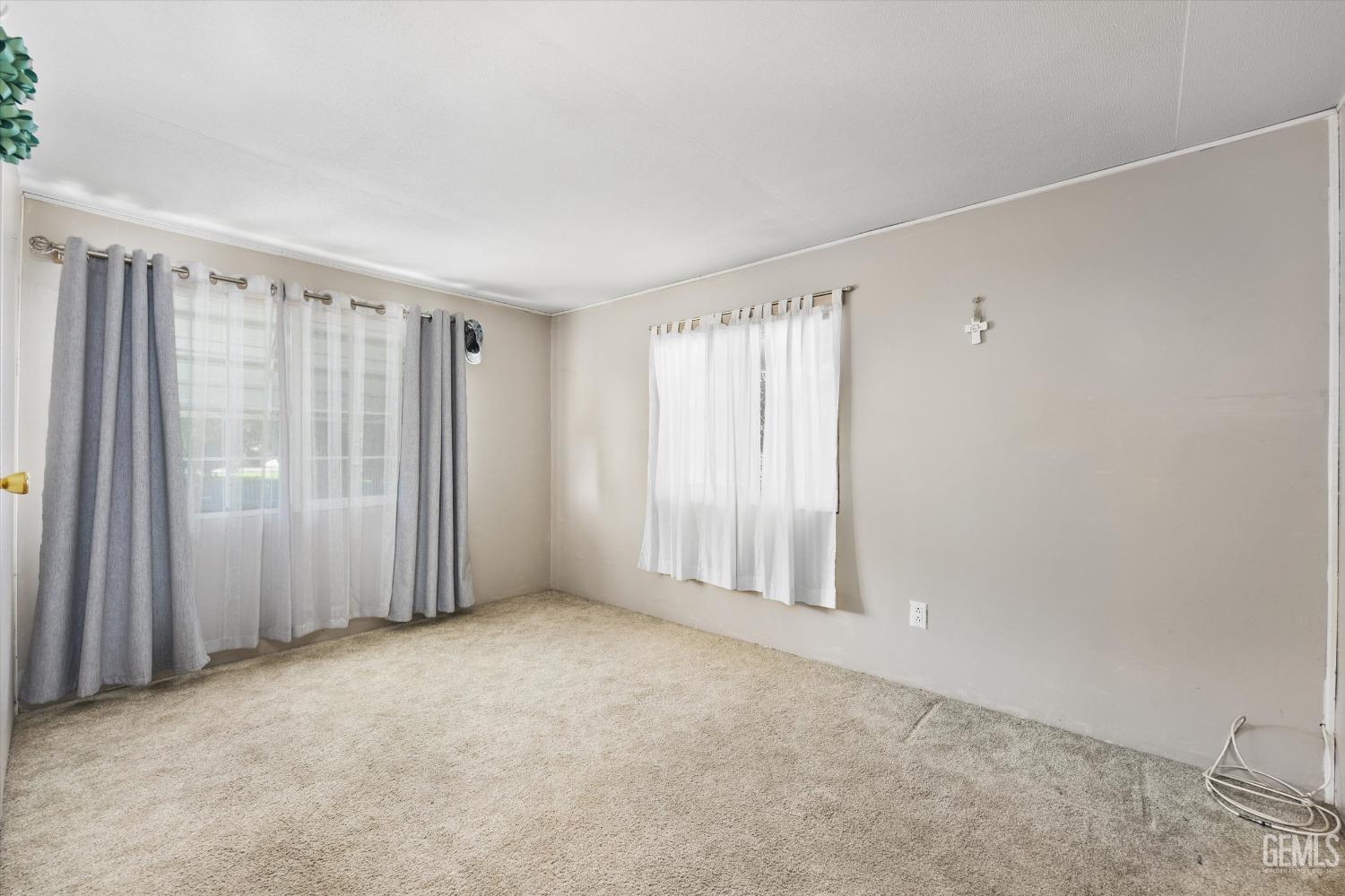 Undisclosed Address Bakersfield, CA 93314 - Photo 19 of 34 an empty room with windows