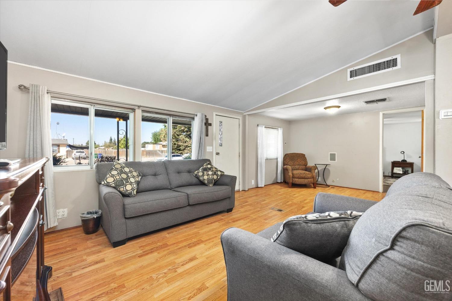 Undisclosed Address Bakersfield, CA 93314 - Photo 8 of 34 a living room with furniture window and a wooden floor