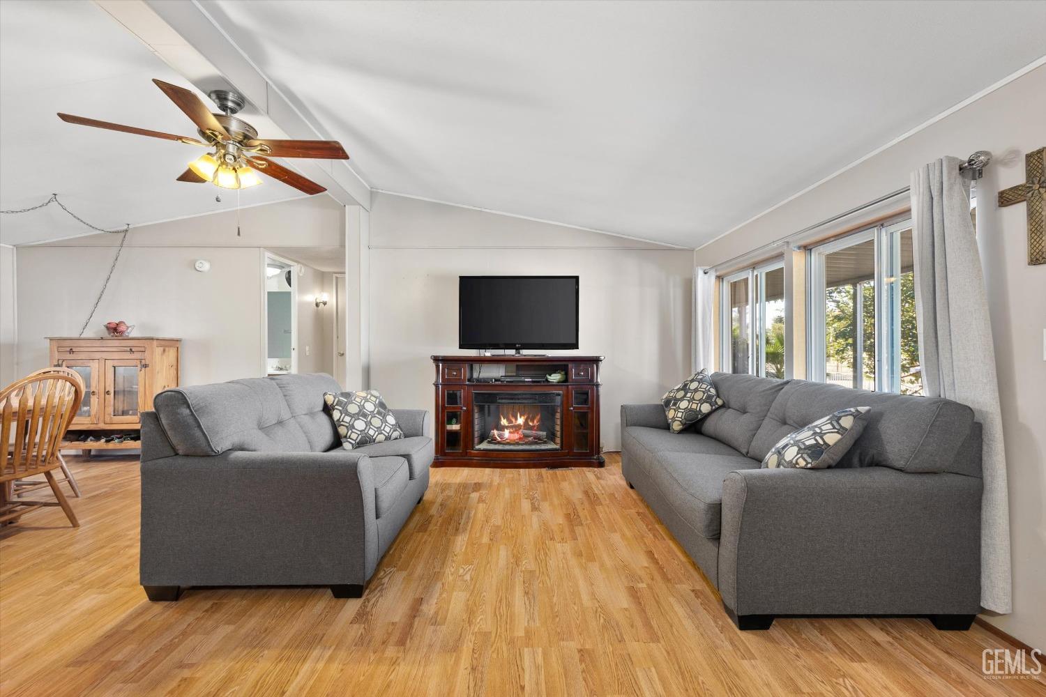 Undisclosed Address Bakersfield, CA 93314 - Photo 9 of 34 a living room with furniture and a flat screen tv
