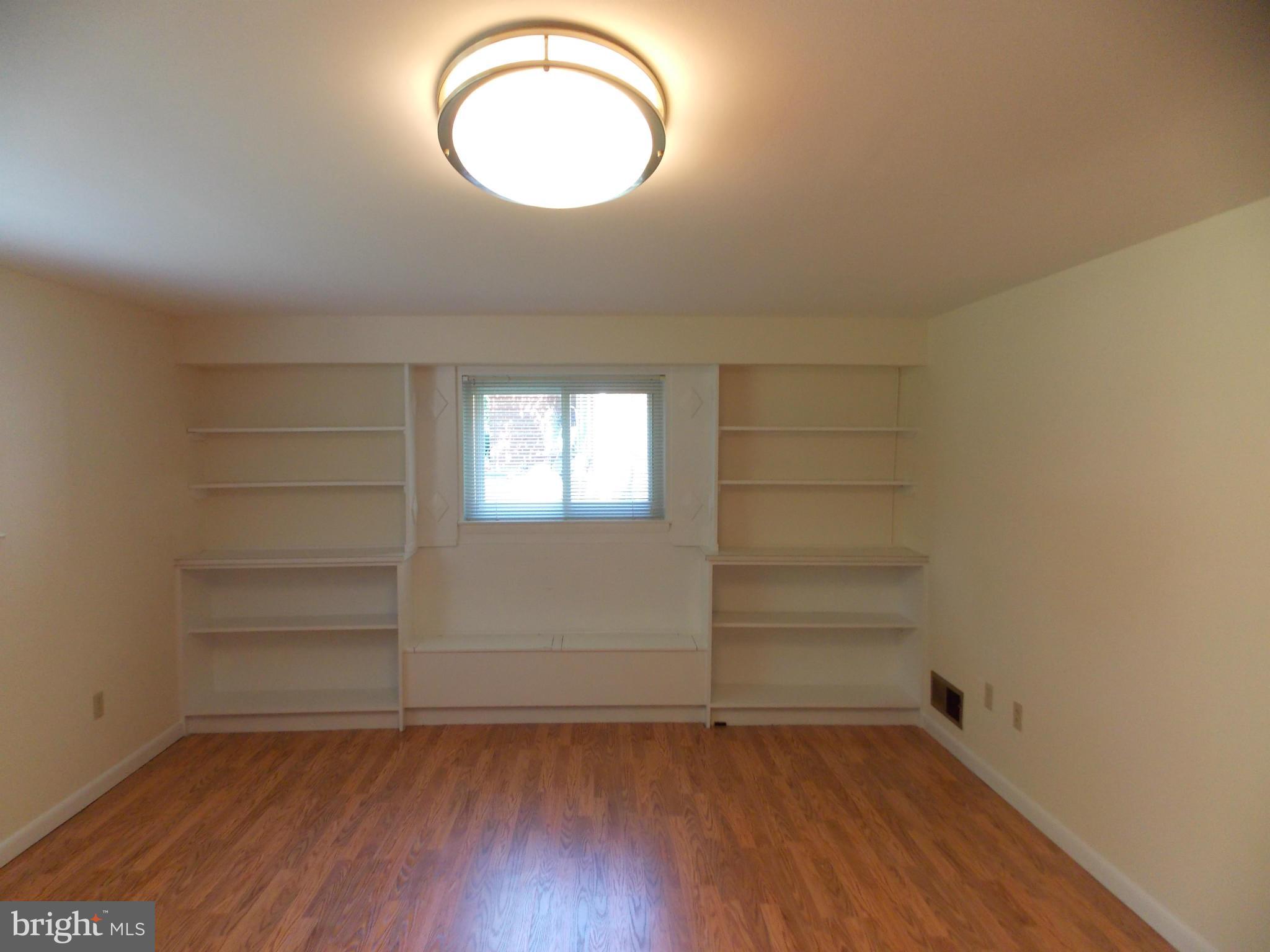 1615 Ladd Street Silver Spring, MD 20902 - Photo 11 of 30 a view of a room with wooden floor and window