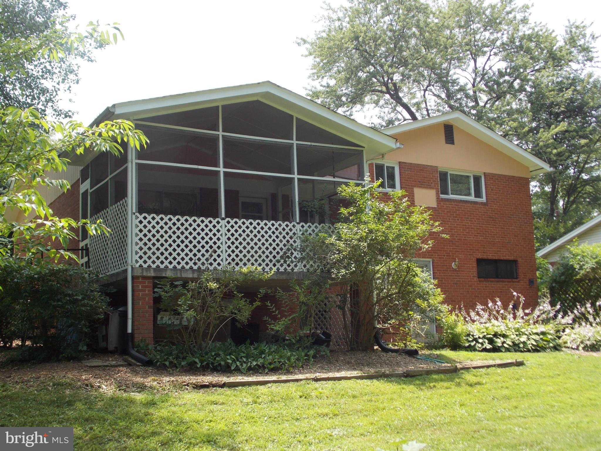 1615 Ladd Street Silver Spring, MD 20902 - Photo 13 of 30 a front view of a house with garden