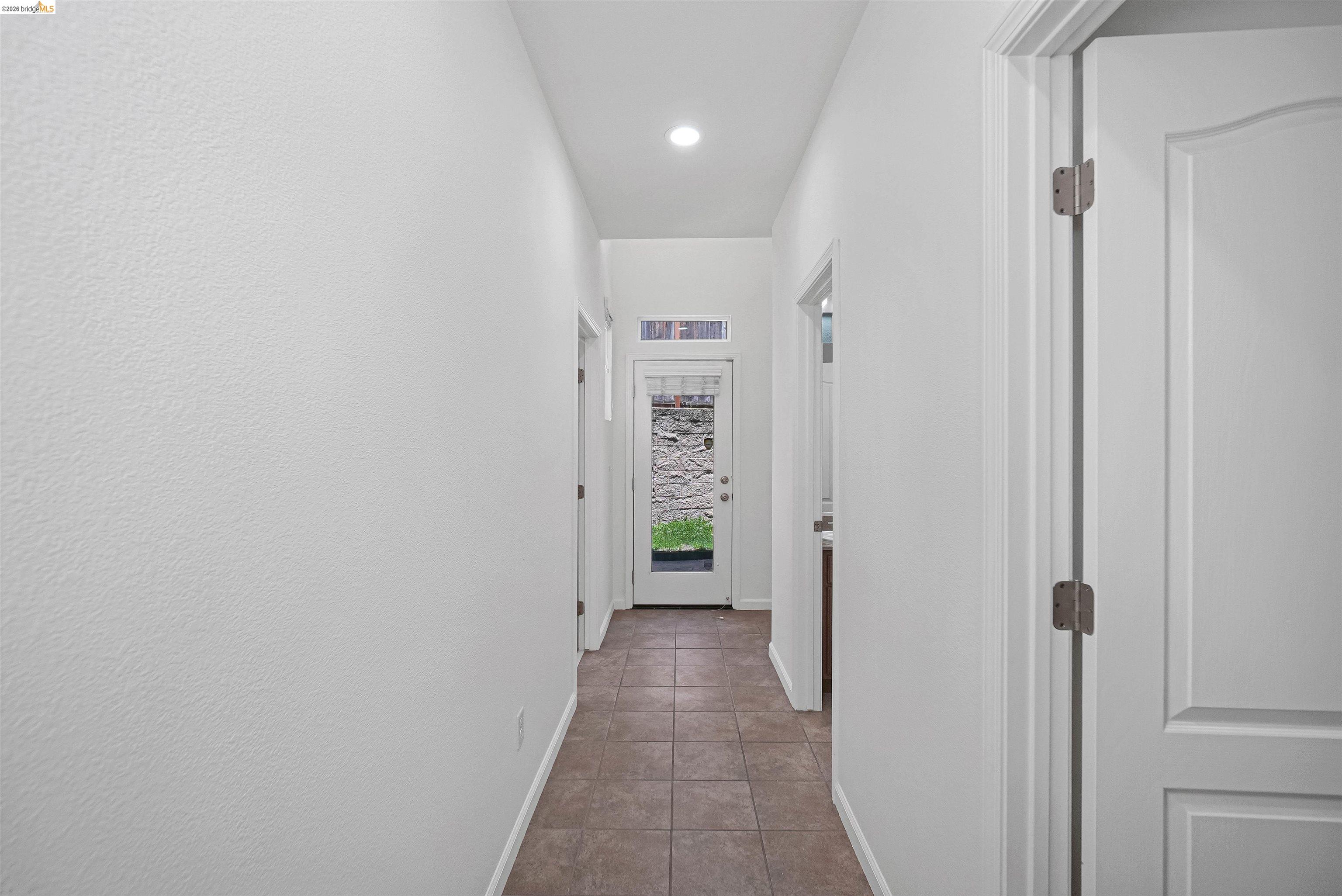 449 Constantine Court San Ramon, CA 94583 - Photo 53 of 63 Hallway featuring tile flooring, white walls, and recessed lighting