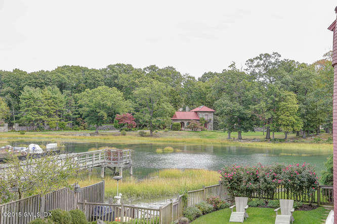 603 Steamboat Road, Unit 1 Greenwich, CT 06830 - Photo 15 of 20 a view of a lake with a house in the background