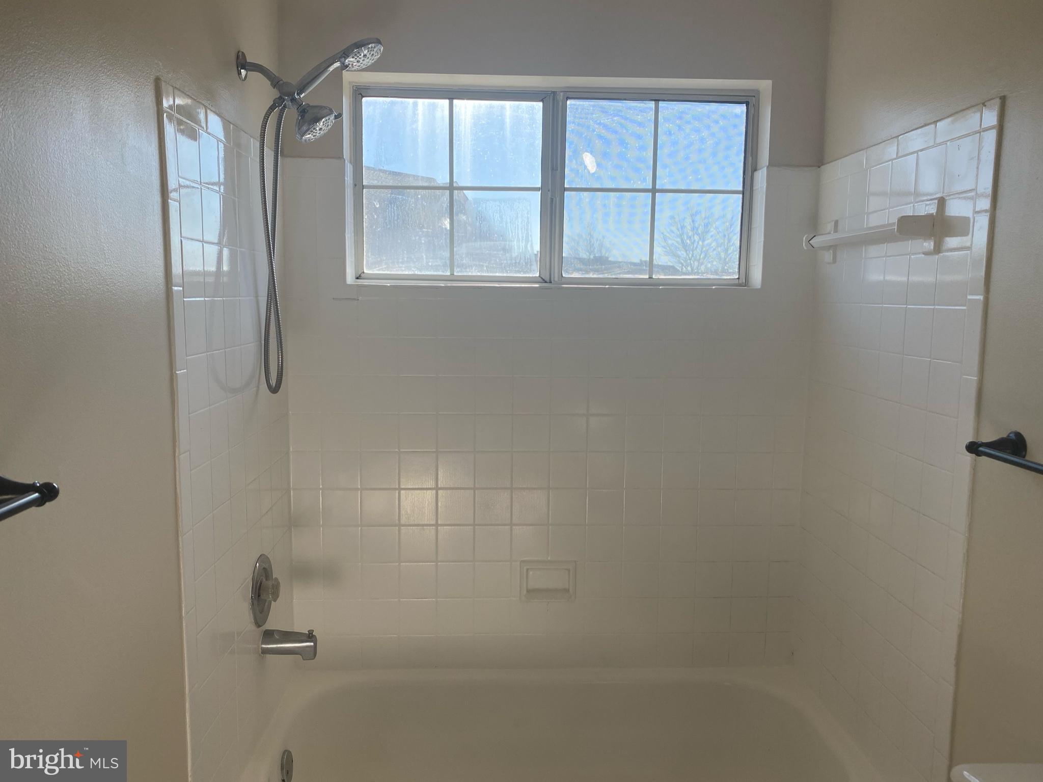 14119 Bowsprit Lane, Unit 312 Laurel, MD 20707 - Photo 16 of 24 a bathroom with a bathtub