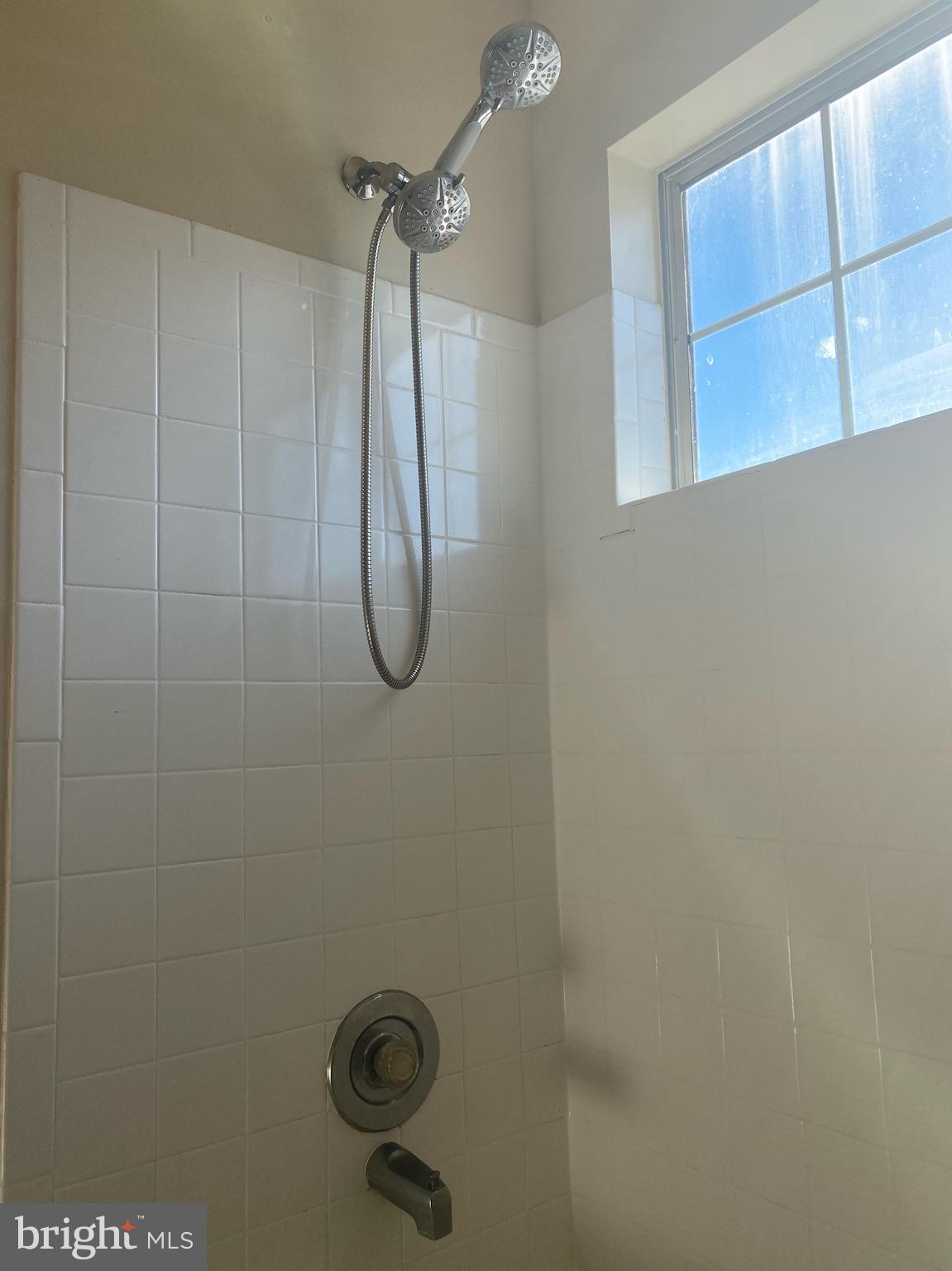14119 Bowsprit Lane, Unit 312 Laurel, MD 20707 - Photo 17 of 24 a bathroom with a shower