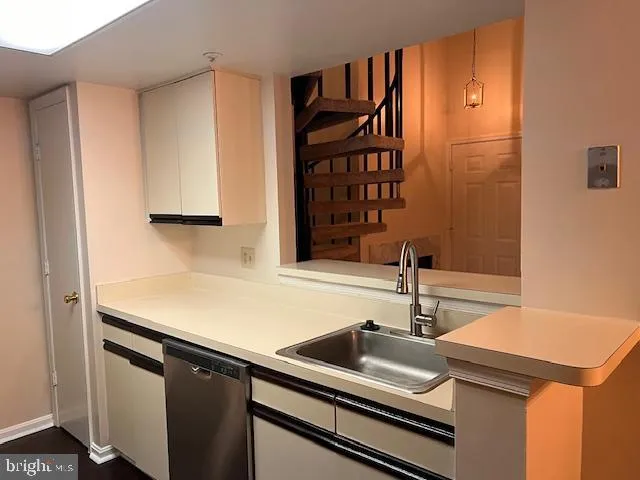 a kitchen with a sink and a cabinets