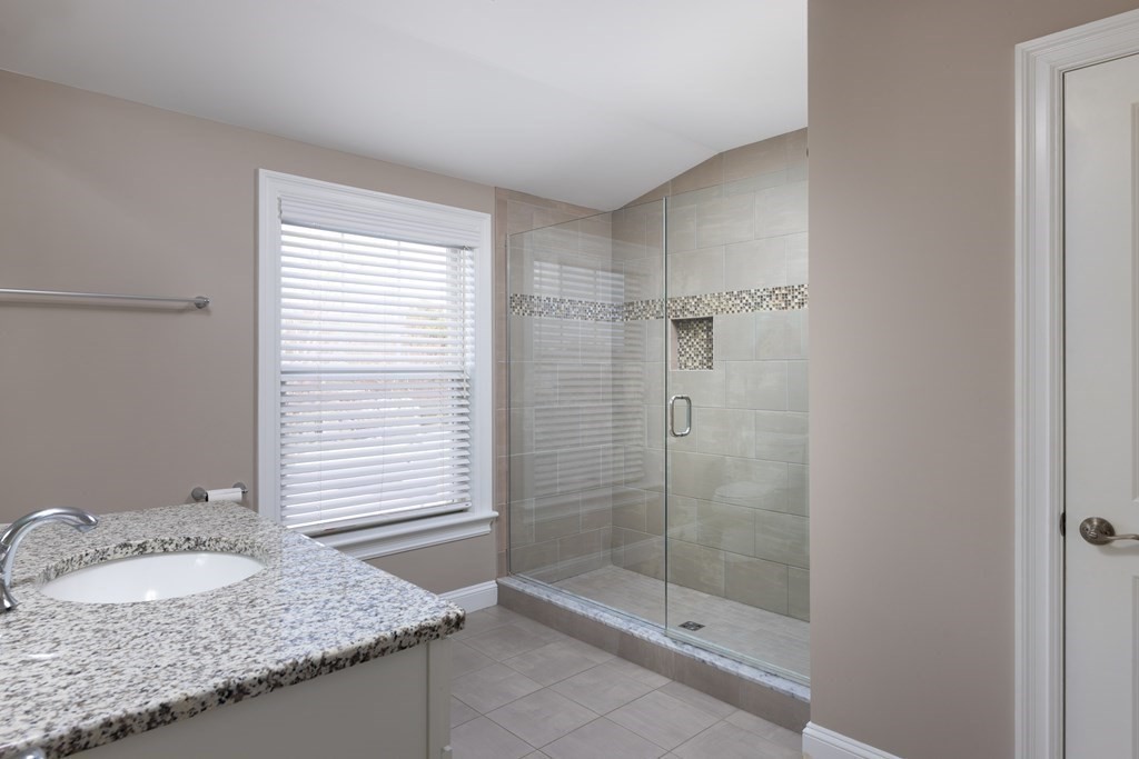 55 Kendall Road Lexington, MA 02421 - Photo 15 of 32 a bathroom with a granite countertop sink and mirror