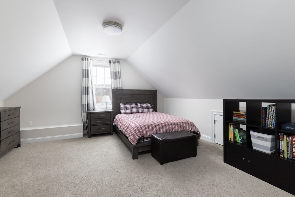 55 Kendall Road Lexington, MA 02421 - Photo 20 of 32 a spacious bedroom with a bed and large window