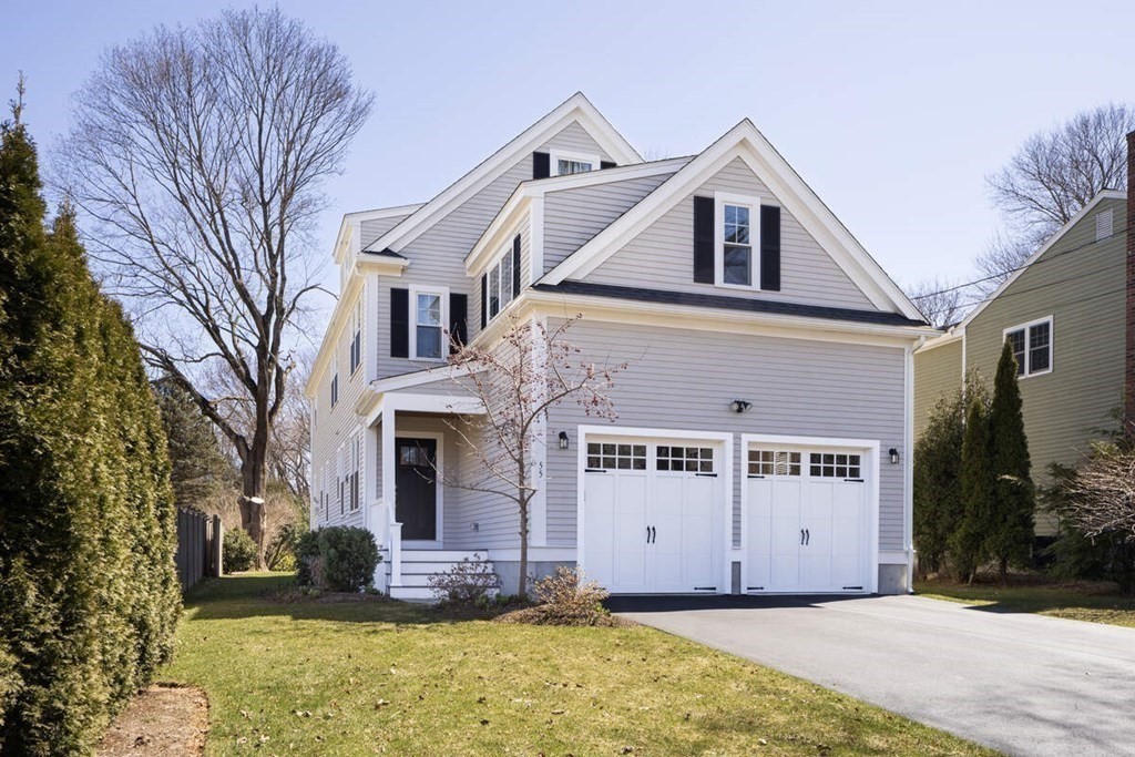 55 Kendall Road Lexington, MA 02421 - Photo 24 of 32 a front view of a house with a yard