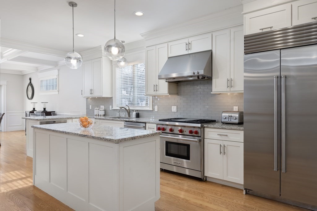 55 Kendall Road Lexington, MA 02421 - Photo 6 of 32 a kitchen with kitchen island a sink stove and refrigerator