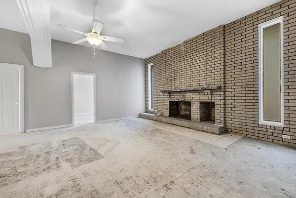 an empty room with a fireplace