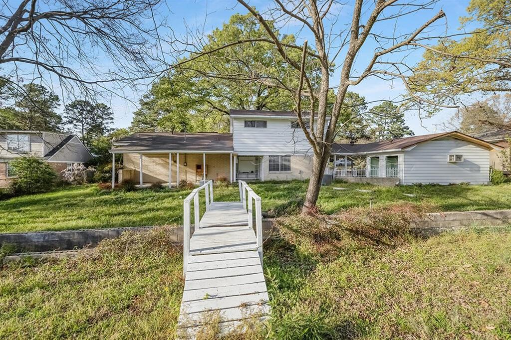 2305 Cherry Hill Road Texarkana, TX 75503 - Photo 2 of 20 a front view of a house with a yard