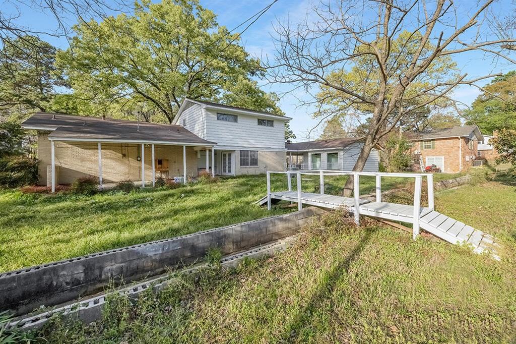 2305 Cherry Hill Road Texarkana, TX 75503 - Photo 3 of 20 a view of a house with a yard and sitting area