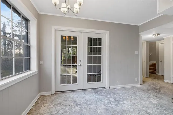 a view of an empty room with a window
