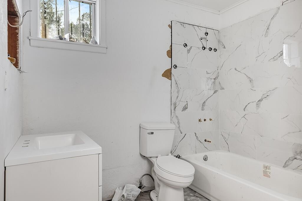 2305 Cherry Hill Road Texarkana, TX 75503 - Photo 9 of 20 a white toilet sitting next to a bath tub shower