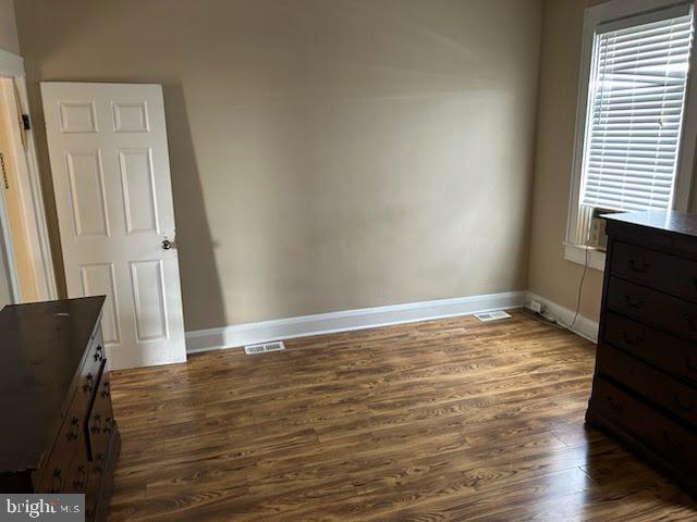 3203 Kenyon Avenue Baltimore, MD 21213 - Photo 23 of 28 a view of empty room with wooden floor and fan