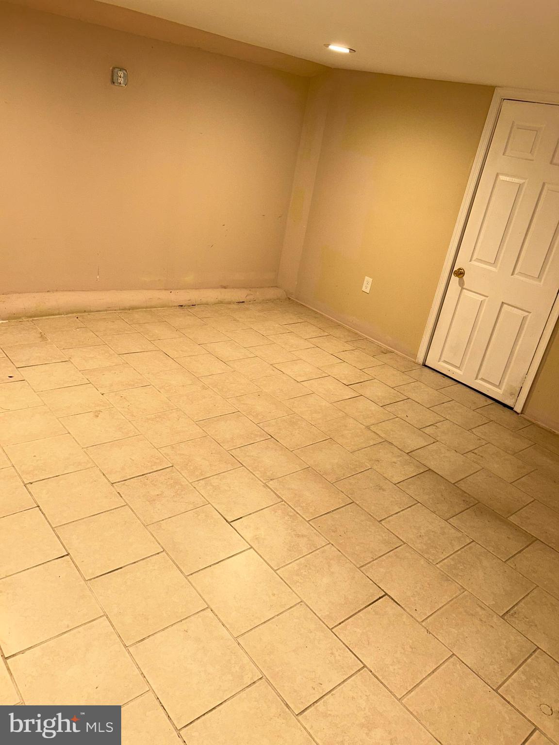 3203 Kenyon Avenue Baltimore, MD 21213 - Photo 25 of 28 a view of an empty room and a window