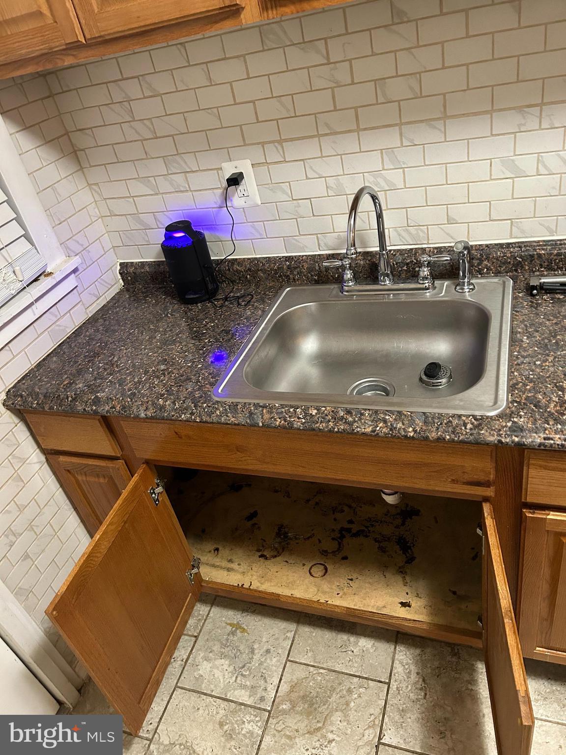 3203 Kenyon Avenue Baltimore, MD 21213 - Photo 10 of 28 a bathroom with a sink and a mirror