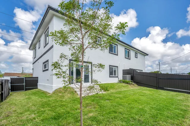 a house view with a garden space