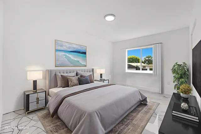 a bathroom with a granite countertop sink a toilet and a mirror
