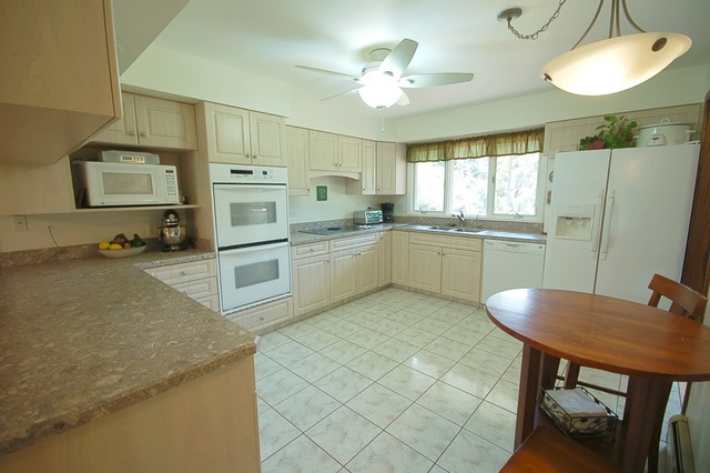 44W482 Ramm Road Maple Park, IL 60151 - Photo 6 of 25 a kitchen with stainless steel appliances granite countertop a stove refrigerator and microwave