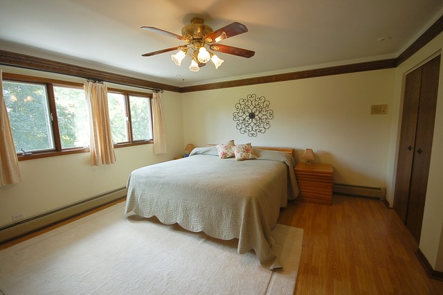 44W482 Ramm Road Maple Park, IL 60151 - Photo 9 of 25 a bedroom with a bed and a chandelier