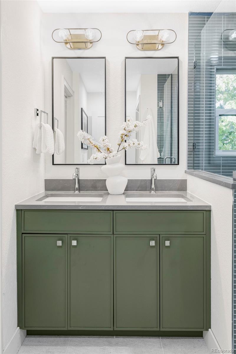 1380 Ithaca Drive Boulder, CO 80305 - Photo 17 of 34 a bathroom with a double vanity sink and a mirror