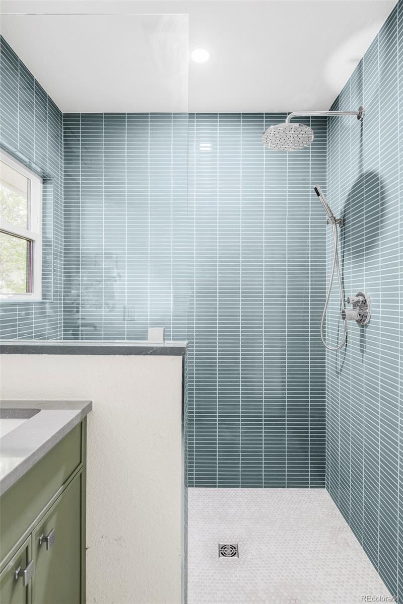1380 Ithaca Drive Boulder, CO 80305 - Photo 18 of 34 a bathroom with a shower and a sink