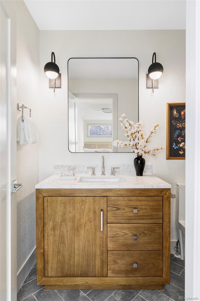 1380 Ithaca Drive Boulder, CO 80305 - Photo 20 of 34 a bathroom with a sink vanity and mirror