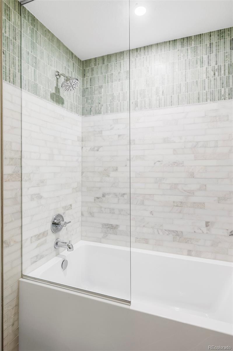 1380 Ithaca Drive Boulder, CO 80305 - Photo 21 of 34 a bathroom with a bathtub and a shower