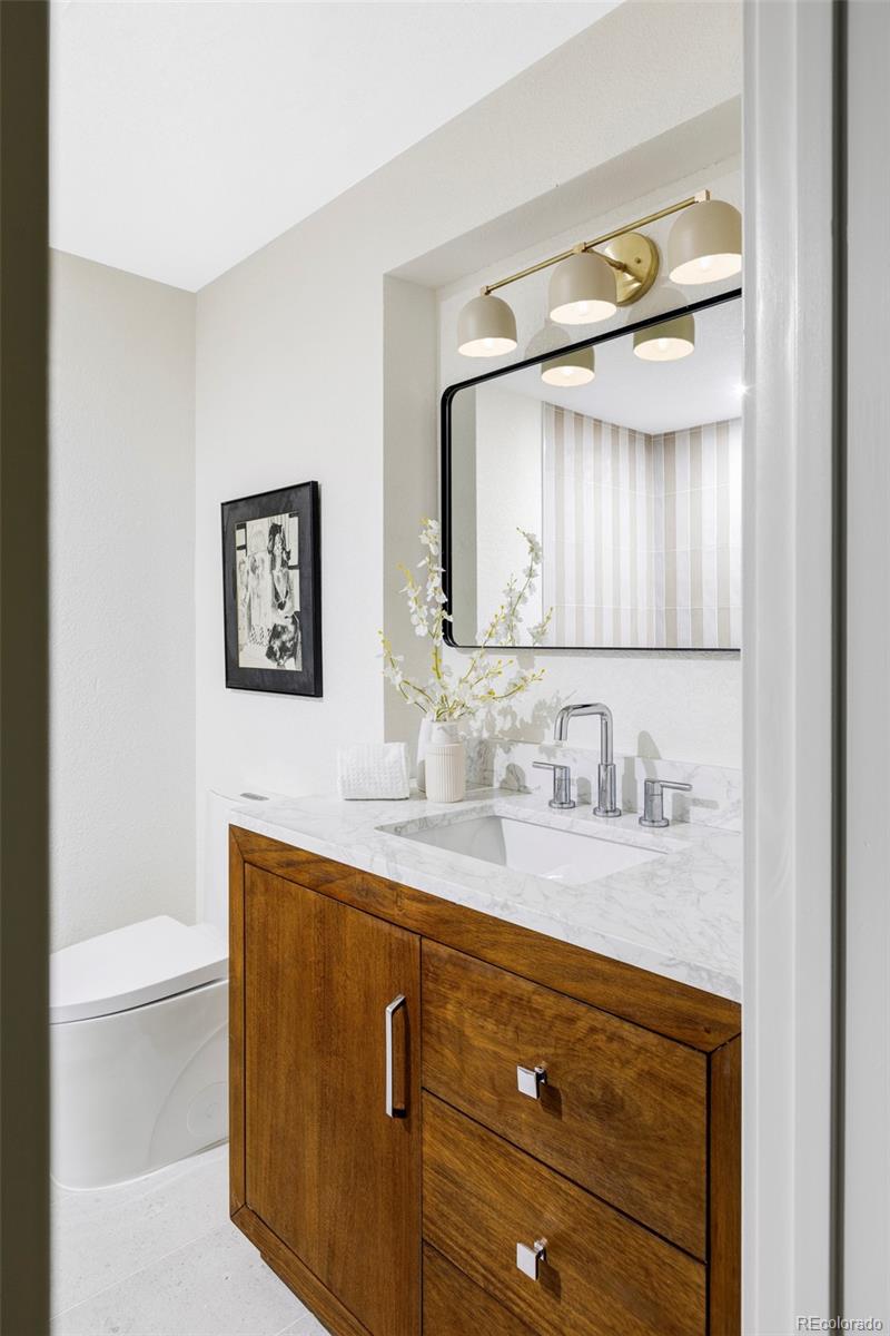 1380 Ithaca Drive Boulder, CO 80305 - Photo 25 of 34 a bathroom with a sink a toilet and mirror